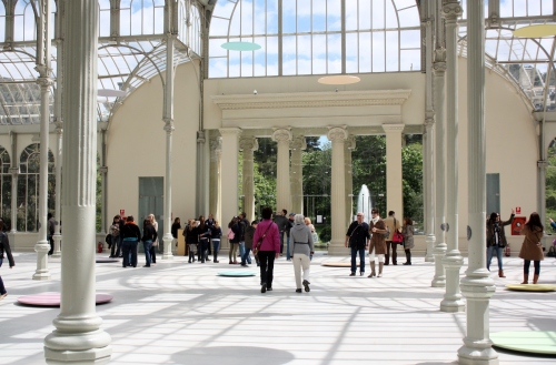 Inside the Palacio de Cristal ~ dics on the floor are part of the modern art exhibition